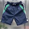 Shorts listrados de verão Calças de praia masculinas de secagem rápida Juventude Moda solta Calças de cinco pontos com correspondência de cores Calças grandes respiráveis finas