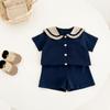 Terno infantil estilo marinho coreano verão novo infantil meninos e meninas tesouro algodão lapela manga curta shorts conjunto de duas peças