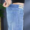 Jeans Feminino Tamanho Grande 2026 Primavera/Verão Novo Jeans de Barra Reta para Mulheres Gordas MM Design Solto Emagrecedor Calças Pantalonas Cropped