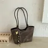Bolsa de mão estilo balde da moda e única, estilo simples para o dia a dia, para mulheres, bolsa transversal de design de nicho versátil para uso casual