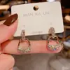 Aguja de plata 925 puesto mercado nocturno suministro aretes moda mujer asimétricos populares explosiones japonesas y coreanas aretes al por mayor A
