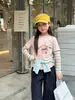 Conjunto de dos piezas para niña Aimobebe: camiseta a rayas de manga larga, parte inferior con estampado de dibujos animados y patchwork, top estilo coreano para niños mayores