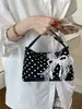 Nuevo bolso de mano cruzado para mujer con diseño único de lazo y lunares, bolso tipo almohada de moda con un toque de alta gama, de un solo hombro y cruzado