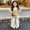 Camisole de malha em camadas de cor sólida para meninas coreanas 2026 outono novo conjunto versátil casual de três peças
