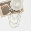 Colección Larga de Collares Superpuestos de Perlas Swarovski para Mujer, Estilo Lujo Ligero, Cadena Versátil para Suéter con un Toque de Alta Gama, Venta al por Mayor Otoño e Invierno