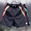 Shorts casuales de verano para hombres y mujeres, marca de moda ins holgados casuales de moda pantalones de longitud media, pantalones versátiles de estilo coreano de cinco puntos