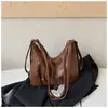 Mochila casual de gran capacidad para mujer 2026 nueva mochila para el trabajo bolsa de hombro cruzada de color liso elegante