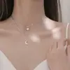 Collar de doble capa estilo ins coreano plata flash Diamante Estrella Luna nicho diseño cadena clavícula femenina lujo ligero nuevo