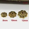 Plata del Tíbet aleación retro flor de toro tapa flor de toro oro antiguo plata del Tíbet toro accesorios para joyería DIY al por mayor