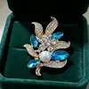 Broche de cristal de strass de alta gama estilo coreano, pasador de aleación, accesorio anti-exposición, broche floral moderno y exquisito, venta al por mayor