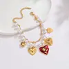 Pulsera de Perlas Estilo Nuevo Retro Europeo y Americano Colgante de Acero Inoxidable Corazón Estrella Joyería de Lujo Ligero de Gama Alta Venta al por Mayor