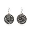Aretes pop transfronterizos Bohemios de aleación hueca geométricos vintage tallados con cuentas de arroz aretes de borla para mujer