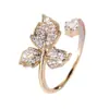 Vendedor Caliente Transfronterizo Anillo Abierto de Hoja de Arce Completamente Incrustado de Diamantes Lujo Ligero Estilo Coreano Sentido de Diseño Nicho Anillo de Hoja Chapado en Oro Zirconia