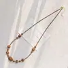 Collar de cadena para clavícula de alta calidad estilo Maillard con diseño de madera de ojo de tigre natural y madera de agarwood