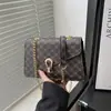 Bolso de cadena retro estampado de color liso de moda, cierre de broche estilo coreano, bolso de hombro para mujer, bolso cruzado, bolso cuadrado pequeño, adecuado para ventas transfronterizas