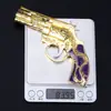 Brinquedo de galinha cinco garras Dragão Dourado roxo com elástico dourado Pistola de brinquedo liga revólver de metal pode explodir Modelo 13cm