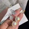Pendientes de Perla Mariposa Suaves 2026 Nuevo Estilo Caliente Pendientes Únicos de Gama Alta Pendientes de Estilo Nicho Primavera y Verano para Mujeres
