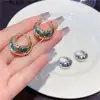 Diseño de nicho de Corea del Sur hebilla redonda de metal para oreja nuevo estilo para mujer estilo frío pequeña cesta pendientes retro joyería para oreja