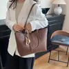 Bolsa de mano grande transfronteriza para mujer, nuevo modelo primavera 2026, bolso de mano versátil de alta gama, bolsa de hombro y para debajo del brazo para el día a día