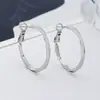 Estilo nuevo delgado adelgazante de cara cara pequeña diseño de nicho textura esmerilada aretes hermoso círculo liso estilo fresco aros redondos clásicos
