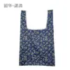 Bolsa cuadrada de tela de flores al por mayor bolsa de compras plegable de tela de poliéster publicidad supermercado almacenamiento portátil bolsa de fresa protección del medio ambiente