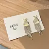 Elegantes Pendientes de Borla con Diamantes y Ojo de Gato Cruzados Versátiles de Lujo Ligero de Alta Gama Modernos Personalizados para el Uso Diario de Mujeres