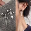 Pendientes de botón con forma de lazo y perlas de diseño elegante y dulce para mujer, nuevos pendientes de alta calidad con un diseño de nicho simple.