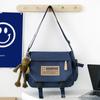Nova Bolsa Transversal Casual Versátil Retrô 2026 para Homens, Bolsa Mensageiro Tendência Estilo Japonês Workwear, Bolsa de Aula para Estudantes de Grande Capacidade