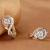 Temperamento coreano aretes de corazón de plata 925 aretes mujer chapados en platino simples de amor aretes venta al por mayor