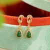 Pendientes Yuebao de plata de ley S925 chapados en oro con diseño retro de jade y calabaza, elegantes y blancos.
