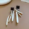 Pendientes de Ganchos para Orejas con Colgante Redondo Geométrico de Ratán y Cuentas de Madera Aguja Plateada Estilo Étnico Vintage Accesorios Únicos para Orejas Sensación de Gama Alta de Nicho