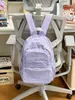 Mochila casual minimalista estilo japonés nueva para niñas, adecuada para compras diarias y ocio, ofreciendo un ambiente fresco y relajado.