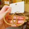 Moda europea y americana, aretes de aro únicos, alta gama, diseño metálico exagerado, aretes de moda, versátiles y chic, estilo minimalista