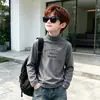 Ropa interior térmica para niños 2026 nuevo estilo coreano ropa de invierno top de cuello medio alto camiseta de manga larga para niños polar térmico venta al por mayor