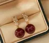 Zhengyuan Shijia Perla Diana Longitud Media Diamante Brillante Aguja Plateada Seiko Aretes Elegantes de Gama Alta Moda Año Nuevo