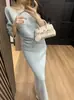 Conjunto Elegante de Color Sólido Nuevo para Mujer Primavera Temprana 2026: Conjunto de Dos Piezas: Suéter Diagonal Abotonado Hombros Descubiertos y Falda Midi de Punto