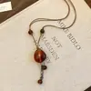 Collar con colgante de madera y cordón de cuero, moderno, a la moda, versátil, elegante, cadena para suéter, lujo ligero, sensación de alta gama, venta al por mayor de joyería