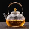 Shishang suministra vaso de vidrio con patrón de martillo resistente a altas temperaturas tetera para hervir agua olla de salud estufa cerámica eléctrica estufa para hervir té perfecto