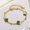 Pulsera de doble capa de cuatro hojas más vendida transfronteriza para mujer, estilo coreano personalizado, fresca, simple, dulce, linda, de acero inoxidable, moderna para el trabajo
