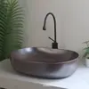 Lavabo de encimera de forma irregular color café moderno de Jingdezhen para baño, balcón y aseo, lavabo integrado de cerámica