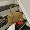 Bolsa Pequena Feminina Retro de Alto Valor 2026 Chegada Nova de Outono Bolsa Boston de Mão Cor Sólida Bolsa Transversal Personalizada Tendência