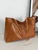 Nova Bolsa Coreana 2025 Bolsa de Mão Grande Feminina Design Retrô Versátil Bolsa Tote Casual de Ombro