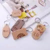 Llavero de madera de haya creativo madera madera casa de campo tarjeta de llave colgante madera maciza letras de hotel coche pequeño regalo