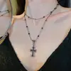 2024 Nuevo Colgante de Cruz con Pedrería Oscura Collar Ajustable en Capas Cadena de Clavícula Larga Superpuesta de Moda Fresca