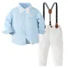 Traje de caballero para niños: camisa de manga larga con cuello azul claro, pantalón largo color blanco roto, juego de tirantes ajustables de color oscuro