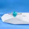 Mu Jing Cultiva Novo Anel Paraíba de Prata S925 com Borda de Pedras Ovais 5*7mm Incrustada para um Look de Verão Iluminado - Transmissão ao Vivo