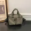 Bolsa pequena quadrada leve xadrez color block casual 2026 nova versátil multi-bolsos prática de ombro crossbody
