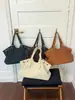 Bolsa vintage de gran capacidad, nuevo modelo verano 2026, alto valor estético, bolso de hombro de color sólido, bolsa de mano casual para el trabajo y los desplazamientos