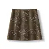 Saia de camurça bordada em jacquard vintage para mulheres, outono, cintura alta, visual emagrecedor, saia curta Maillard, linha A que abraça o quadril