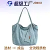 Bolsa Jeans Casual Versátil Personalizada Nova Verão 2025 para Mulheres, Bolsa de Mão e Bolsa de Ombro Texturizada Simples de Grande Capacidade